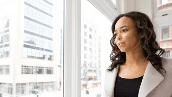 woman looking out the window